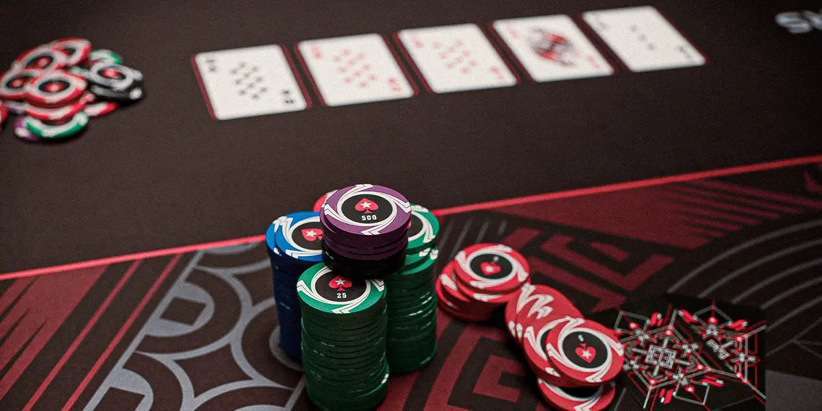 Close-up of poker chips and cards on a table, emphasizing strategic play and bluffing against weak opponents.