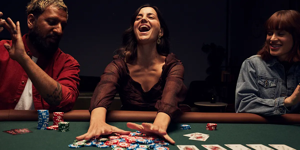 Poker player winning a big multiway pot