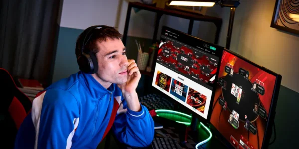 Poker player grinding multiple online poker tables simultaneously on a monitor.