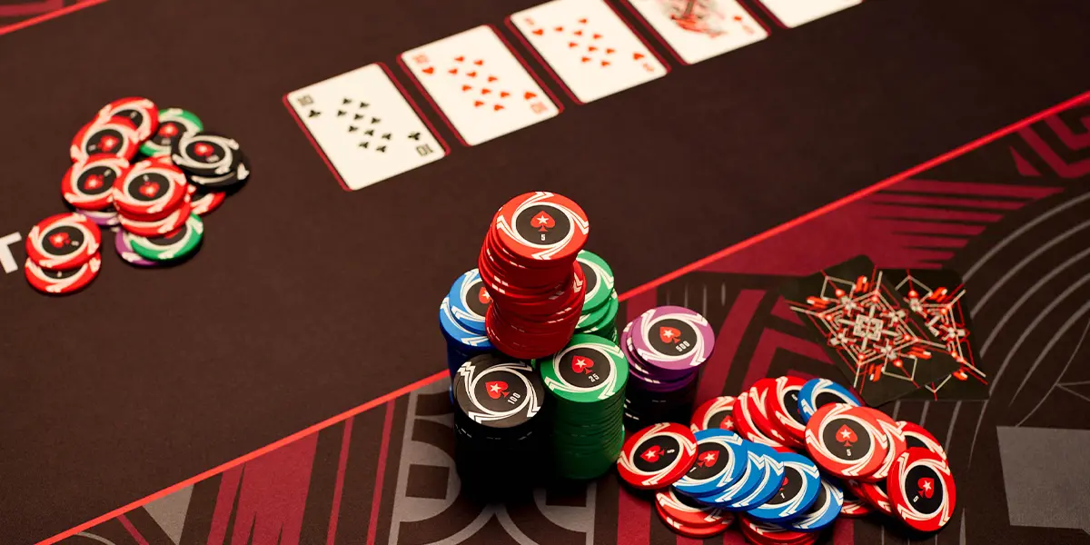 Close-up of poker chips and cards during a high-pressure hand