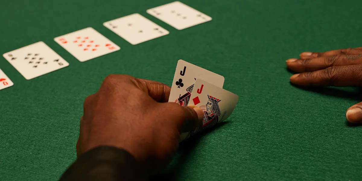 A poker player deep in conscious deliberation, facing a river decision in a well-studied spot.
