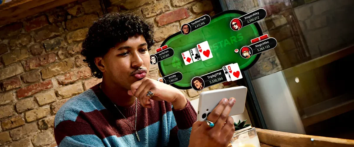 A poker player playing online poker on his smartphone with a virtual poker table overlay showing a pair of Queens.