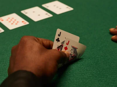 A professional poker player looking intensely at the table, representing the practice of hand reading and range analysis.