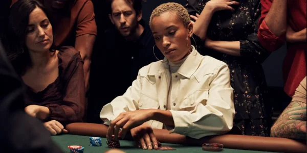 Concentrated poker player calculating pot odds against a short stack.